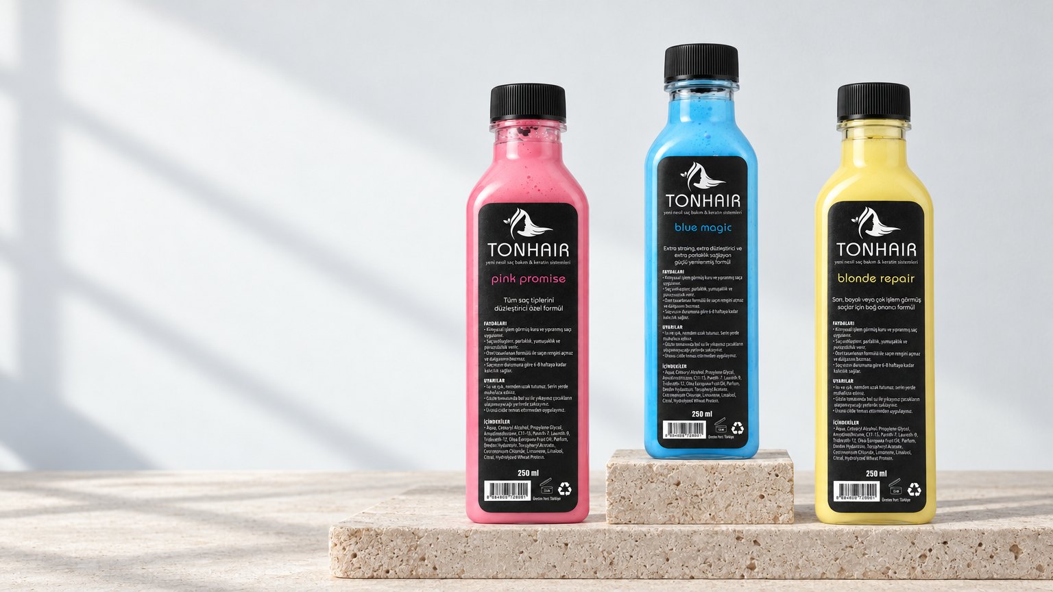 Pinky Promise, Blue Magic ve Blonde Repair şişeleri taş kaide üzerinde